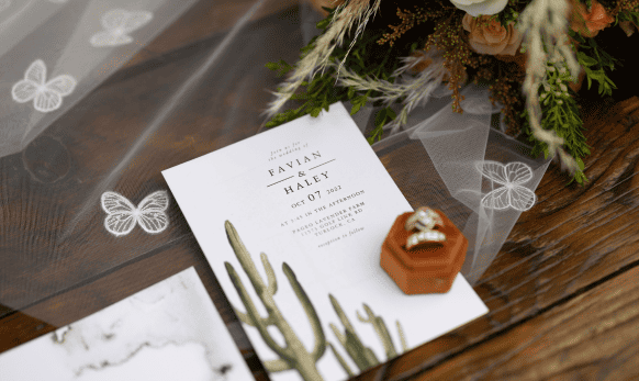 A wedding invitation with a cactus on it.
